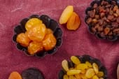 bowls of dried raisins and apricots