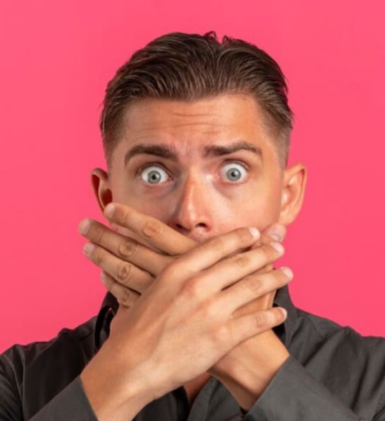 Man with hands covering face