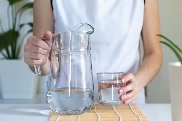 Woman pouring a glass of water